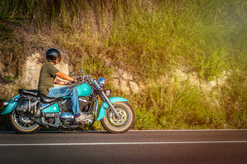 Motorcyle ride on a country road at dusk