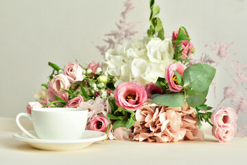 bouquet of delicate pink flowers and gift or present box . Flowers.Greeting card for Birthday, Woman or Mothers Day. I love you concept.Good morning.Selective focus.Copy space.