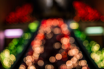 Macro closeup of many red candles with flame in church