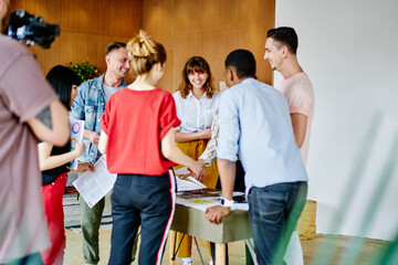 Group of cheerful people discussing plan strategy for startup project enjoying friendly...