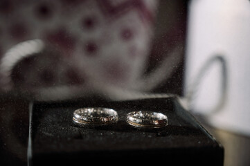 Two silver wedding rings. Close-up view of silver wedding rings in a box