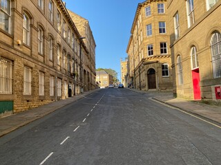 Looking along, Currer Street, at former Victorian textile mills, on a late summers day in, Little Germany, Bradford, Yorkshire, UK