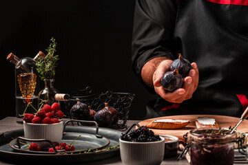 Chef is cooking salad with fruits figs, ricotta cream cheese thyme, honey. catering, banner, menu, recipe, place for text
