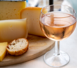 Tasting and pairing of cold rose wine with different cheeses in sunny Provence, France