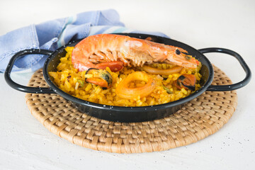 Paella typical spanish food in granite background