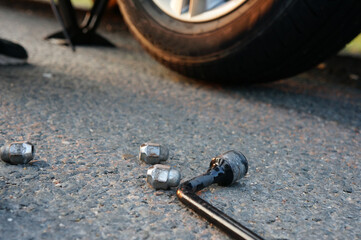 worn out car tire with hole and steel cable. The concept of the inadmissibility of using old tires, breakdown on the road