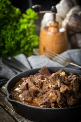Beef stew in a cast iron skillet.