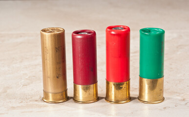 front view of a variety of twelve gage shot gun shells, both 