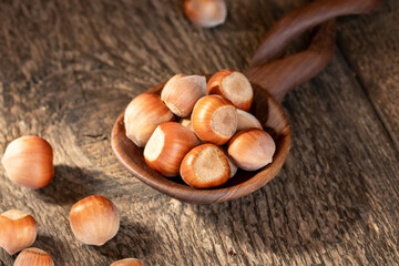 Hazelnuts in a blue pot on a table
