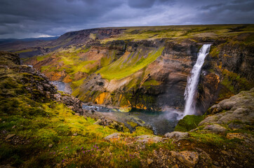 Obraz premium The photo shows beautiful Haifoss waterfall in the Iceland. It is the second largest waterfall in the Iceland.
