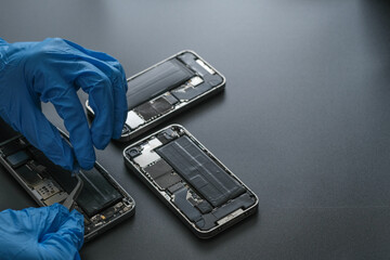 Technician repairing the Cell phone parts and tools for recovery repair phone smartphone and...