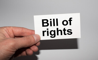 Message on the card BILL OF RIGHTS, in hands of businessman.