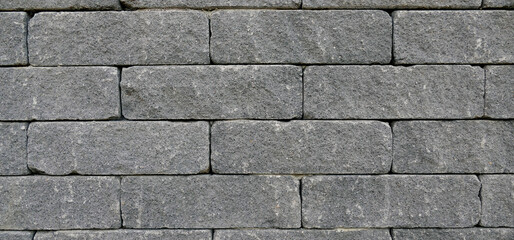 Texture of a masonry bond of concrete blocks, background wallpaper