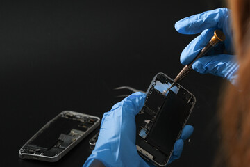 Technician repairing the Cell phone parts and tools for recovery repair phone smartphone and...