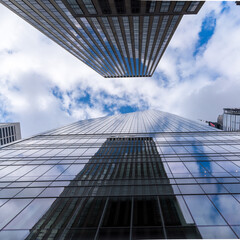 Fototapeta na wymiar Glass skyscraper looking up