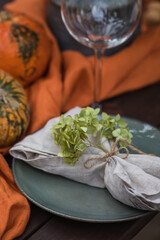 Fall themed holiday table setting arrangement for a seasonal party