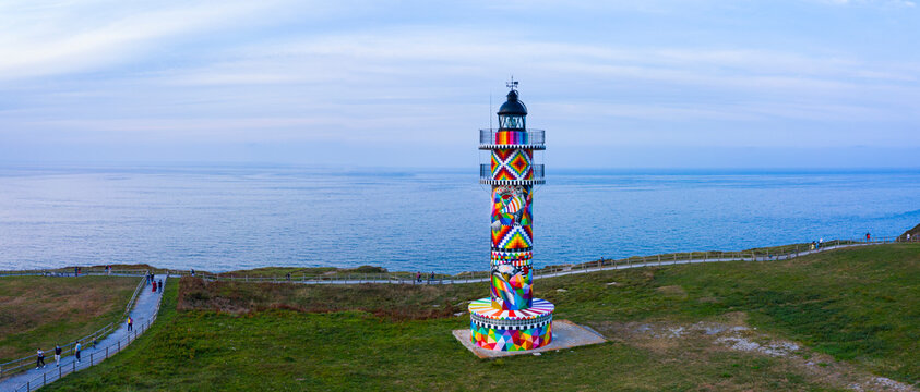 Cabo de Ajo Lighthouse painted by the painter Okuda San Miguel, specialized in Urban Art. Ajo, Bareyo Municipality, Cantabria, Cantabrian Sea, Spain, Europe