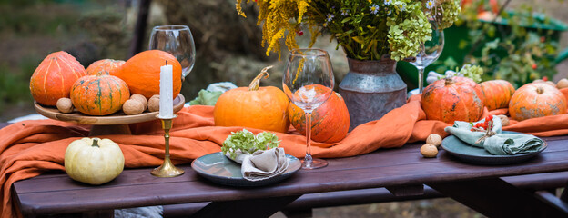 Fall themed holiday table setting arrangement for a seasonal party, banner