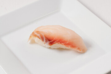 Sushi menu. Japanese food decorated with cheese on white plate.