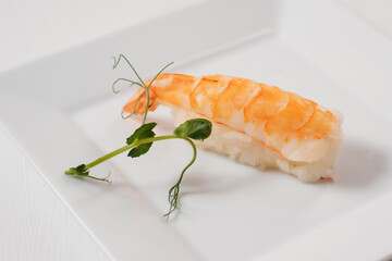 Sushi menu. Japanese food decorated with greenery.