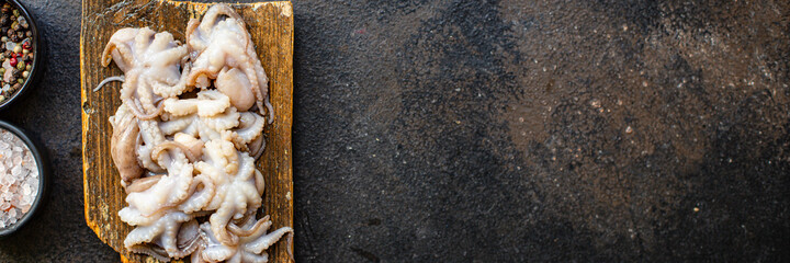 octopus raw seafood fresh baby size on the table serving size top view copy space for text diet pescetarian food background rustic