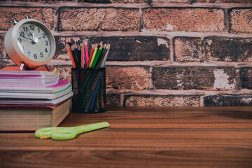 back to school concept. stationery items on wooden desk