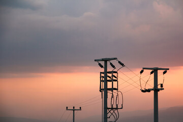 Turkey's power grid line in the mountains at sunset