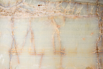close-up onyx slab cut-off background with textural relief and pattern