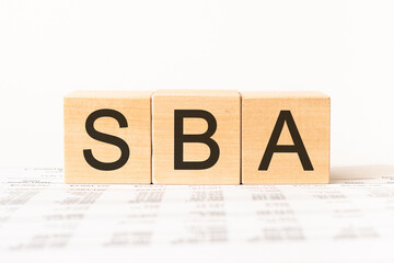 Word sba. Wooden small cubes with letters isolated on white background with copy space available.Business Concept image.
