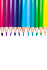 multicolored wooden pencils in rainbow shades in order on a white isolated background mock up, vertical, high quality photo.