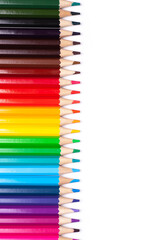 multicolored wooden pencils in rainbow shades in order on a white isolated background mock up, vertical, high quality photo.
