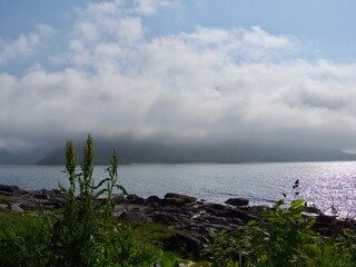 Summer cloudy Lofoten islands. Norway misty sea and fjords.