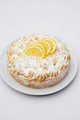 lemon pie with lemon slices on white table
