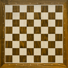 Top view on wooden chess board. Chess game.