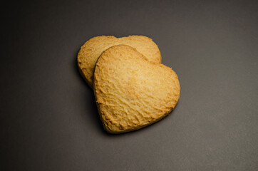 Heart-shaped cookies on a gray background. Delicious snack.