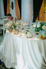 Wedding table decoration with flowers.Decoration of the banquet hall on the wedding day