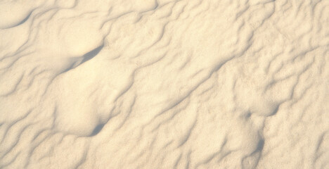 Beach sand as a travel background with texture.