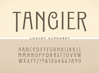 Tangier condensed alphabet: a tall antique styled luxury font.
