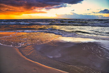 Sunset view over the sea. Beautiful sunset over the sea. View of the beach, sea and sunset.