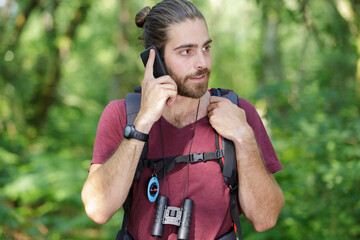 man hiker on the phone