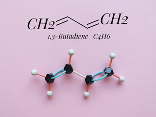 Structural chemical formula and molecular structure model of 1,3 - butadiene molecule. It is the...