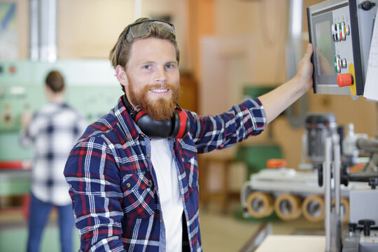 A Happy Man Operating Machine