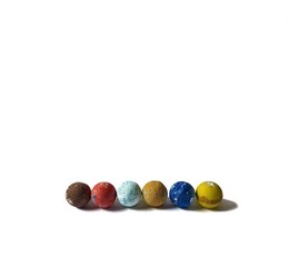 Polystyrene colored balls on white background. decorative concept