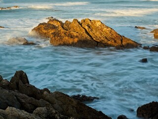 Rock surrounded by water from the Cantabrian Sea.