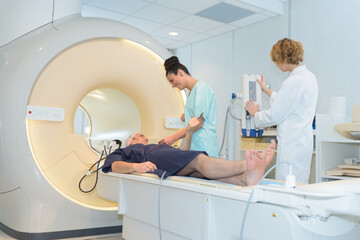 patient undergoing mri scan at hospital - obrazy, fototapety, plakaty