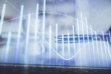 Double exposure of forex chart over coffee cup background in office. Concept of financial analysis and success.
