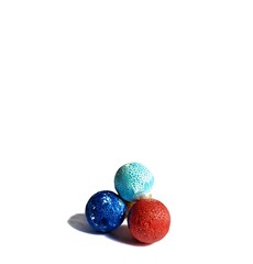 Polystyrene colored balls on white background. decorative concept