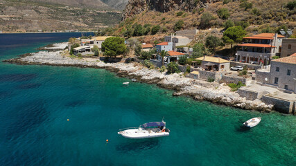 Obraz premium Aerial drone photo of beautiful small seaside village of Limeni with emerald clear sea, Mani Peninsula, Lakonia, Peloponnese, Greece