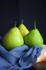 Juicy green pears on a black background.Healthy food.