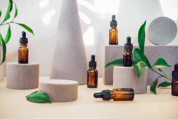 Trendy background of geometric shapes with natural essential oils bottles, fresh leaves and empty central podium for product presentation. Beauty and body care product concept. Sun light and shadows.